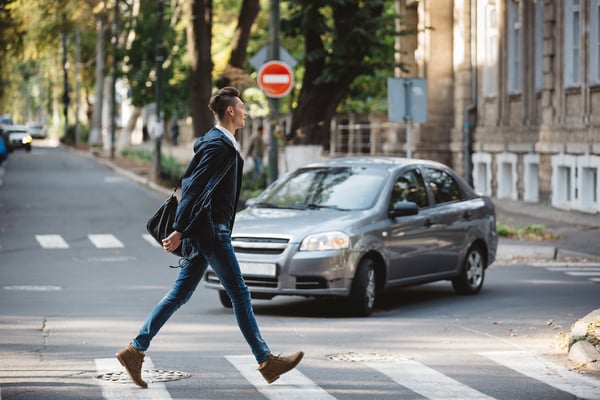 man using pedestrian crossing
