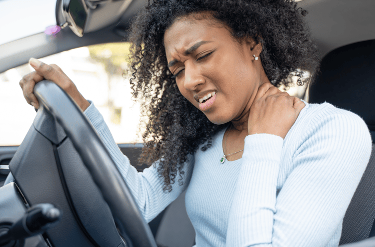woman experiencing a car accident neck injury