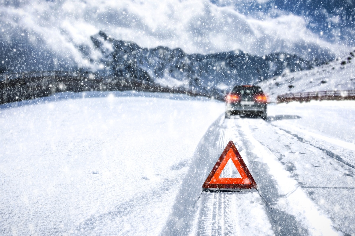 Drowsy-driving-holiday-063494-edited A car driving on a snowy road