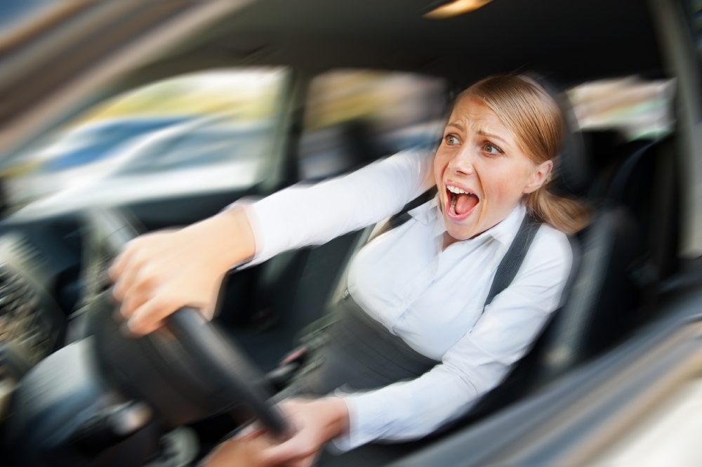 LOW%20accigirl-818564-edited A woman screaming, speeding, and taking a hard drift.