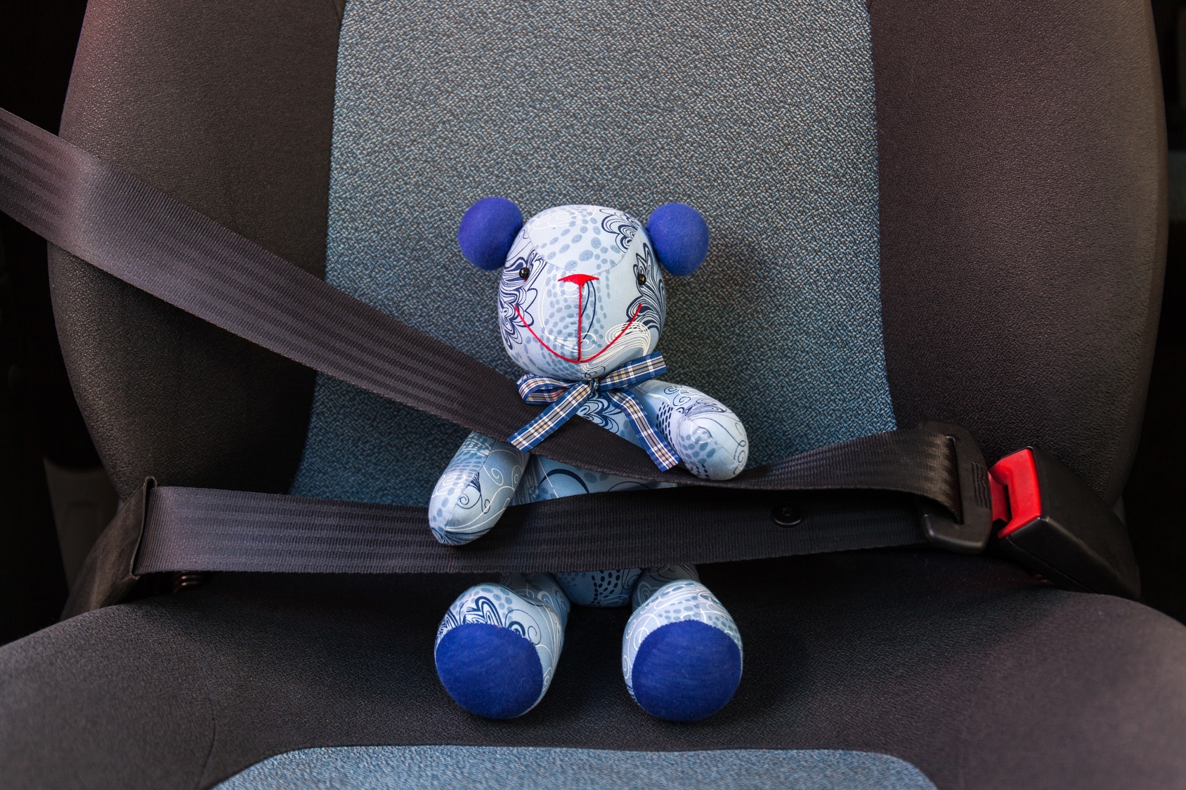 National_Safety_Month_2017 A teddy bear buckled up.