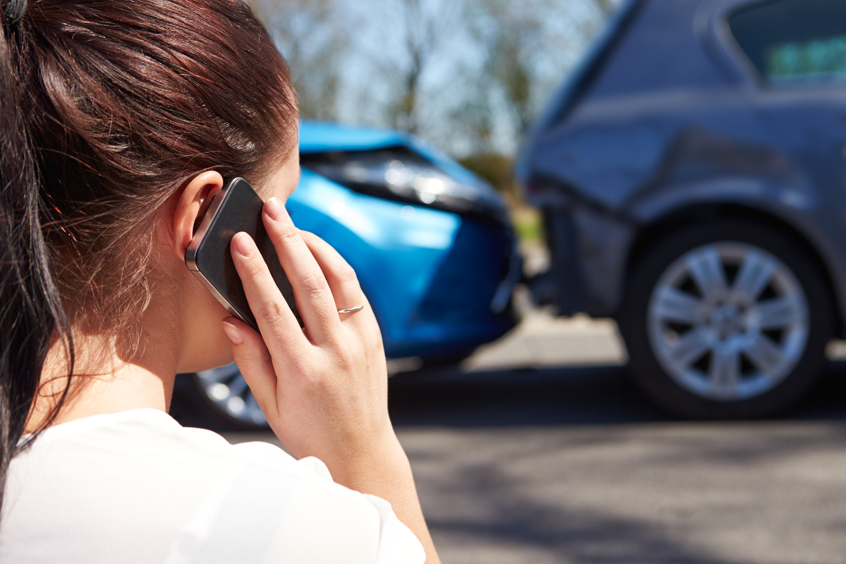 Female Driver Making Phone Call After Traffic Accident Female Driver Making Phone Call After Traffic Accident