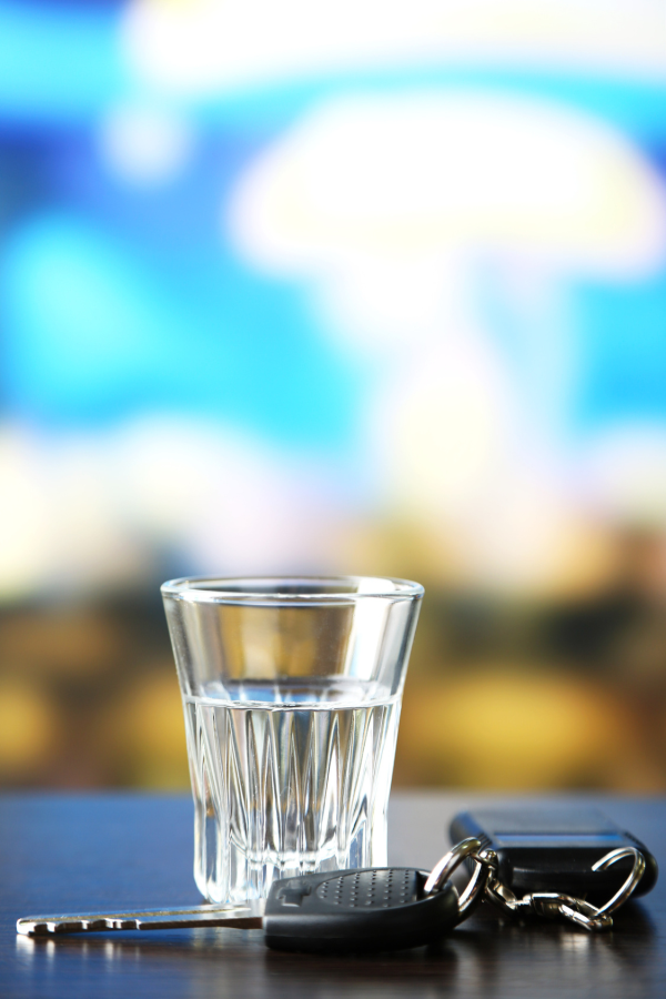 dui_accident_shot_glass-resized-600 a shot glass next to a set of car keys