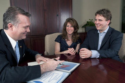 Couple talking to Financail advisor Couple talking to Financail advisor