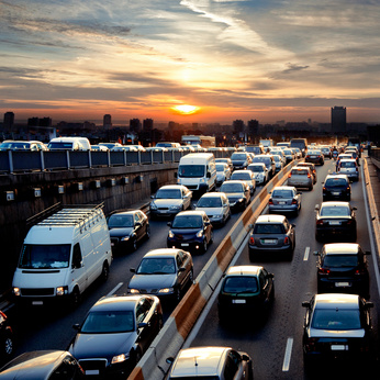 Rush hour in the late afternoon. Traffic. Late afternoon traffic. Traffic jam. Cars. Urban scene.