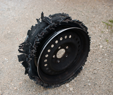 damaged tire after tire explosion at high speed on highway damaged tire after tire explosion at high speed on highway