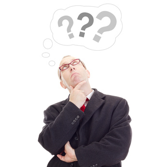 Business person thinking about question Business person thinking about question
