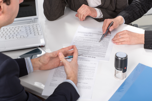 People discussing legal documents