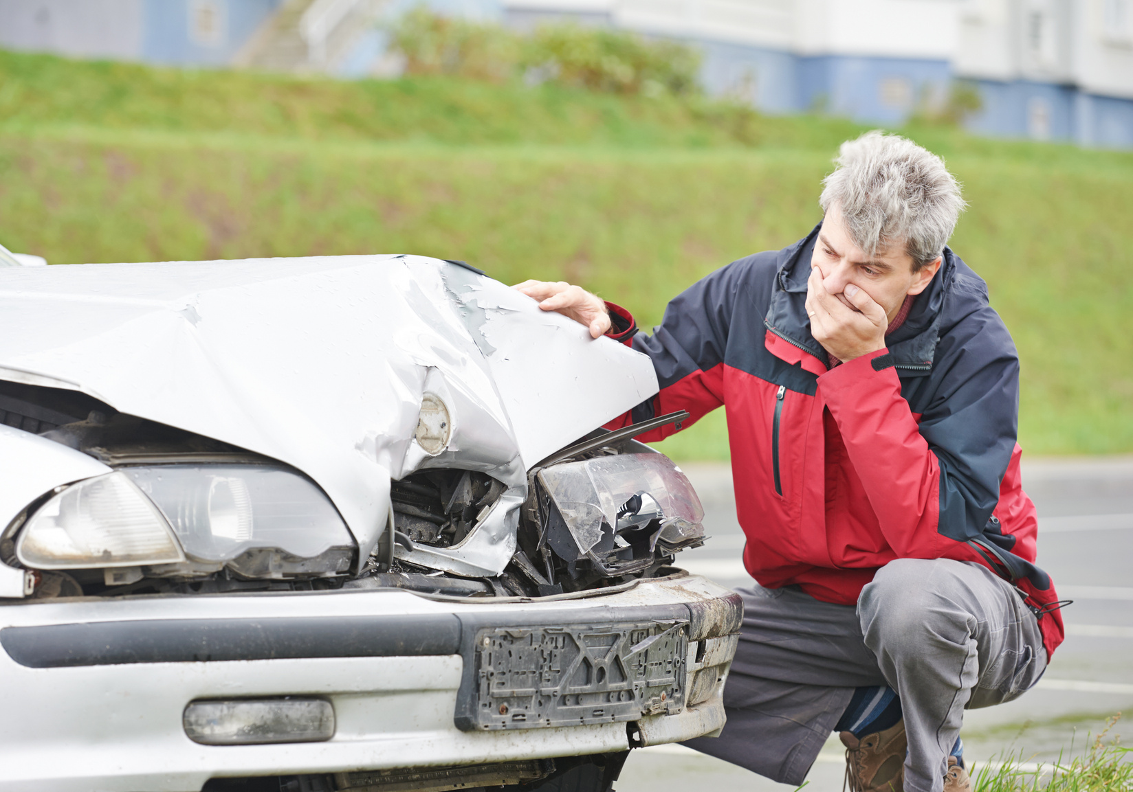 upset man after car crash Adult upset driver man inspecting automobile body after crash car collision accident