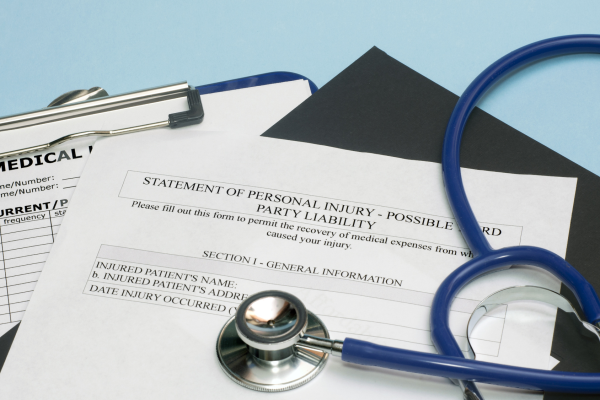 fotolia_64236299_subscription_monthly_m-resized-600 A statement of personal injury form and a stethoscope