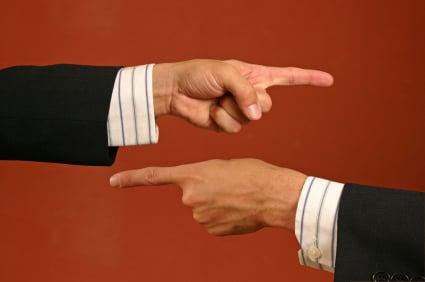 istock_000001565361_extrasmall two people pointing the blame at each other