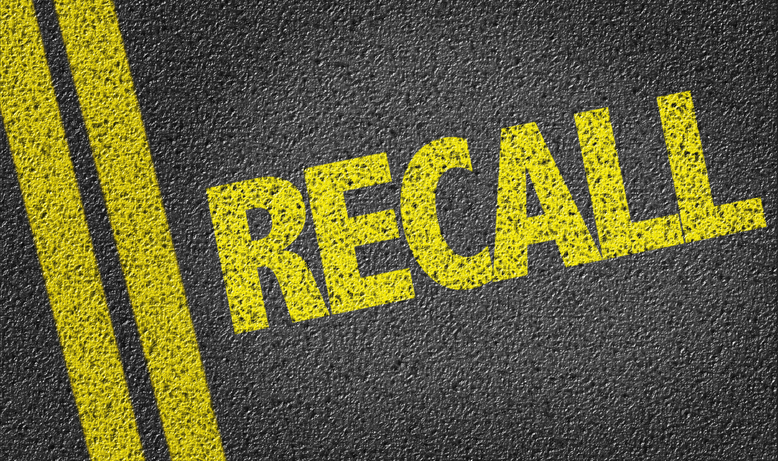 Recall The word recall painted on the road