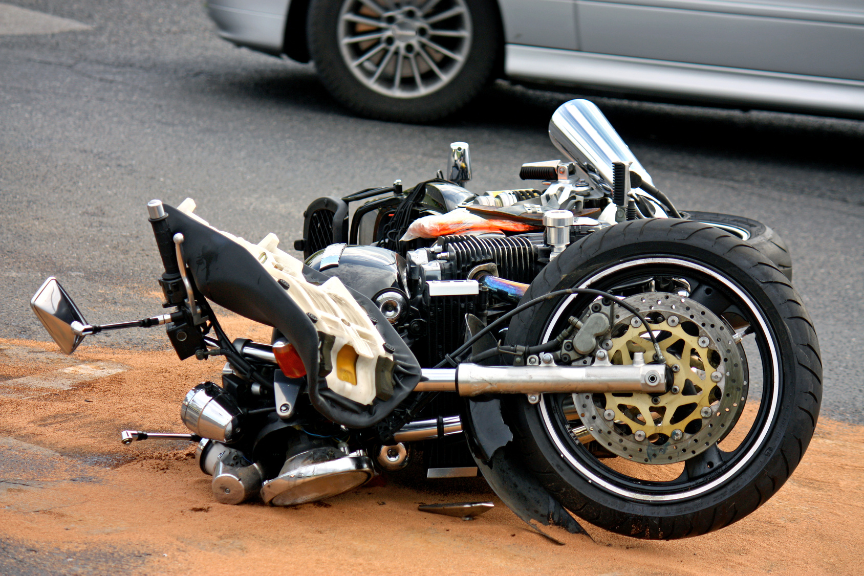 black motorbike accident on the asphalt road a motorcycle after a crash