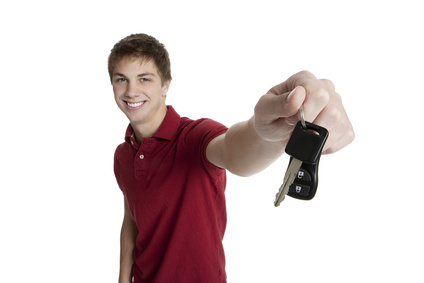 teenage boy holding car keys