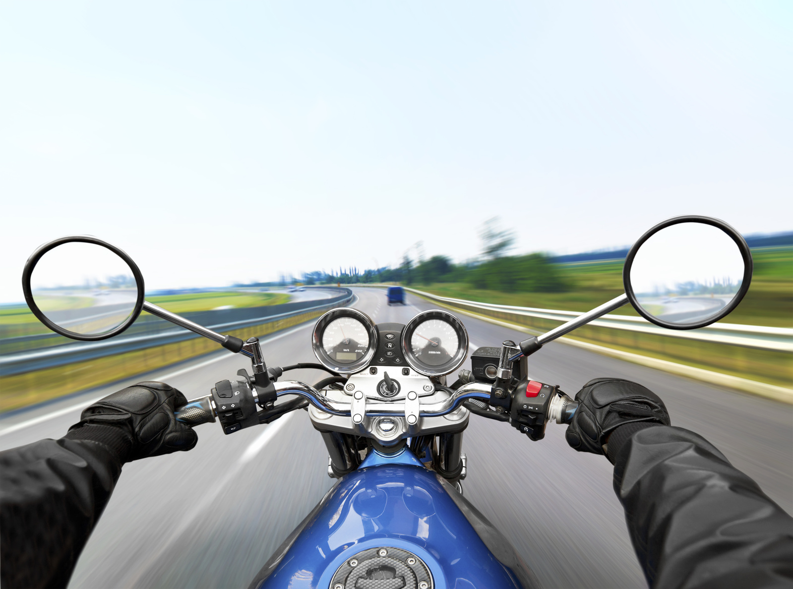 Man driving on moto on big speed on asphalt road