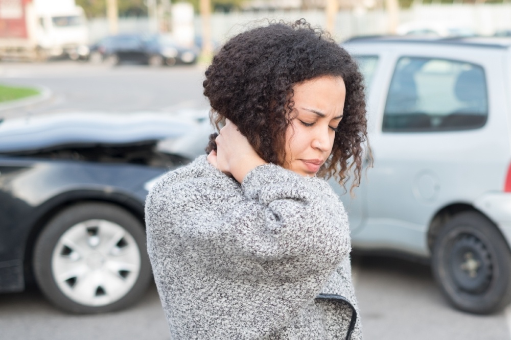 whiplash%20woman-730126-edited Woman holding her neck after an accident